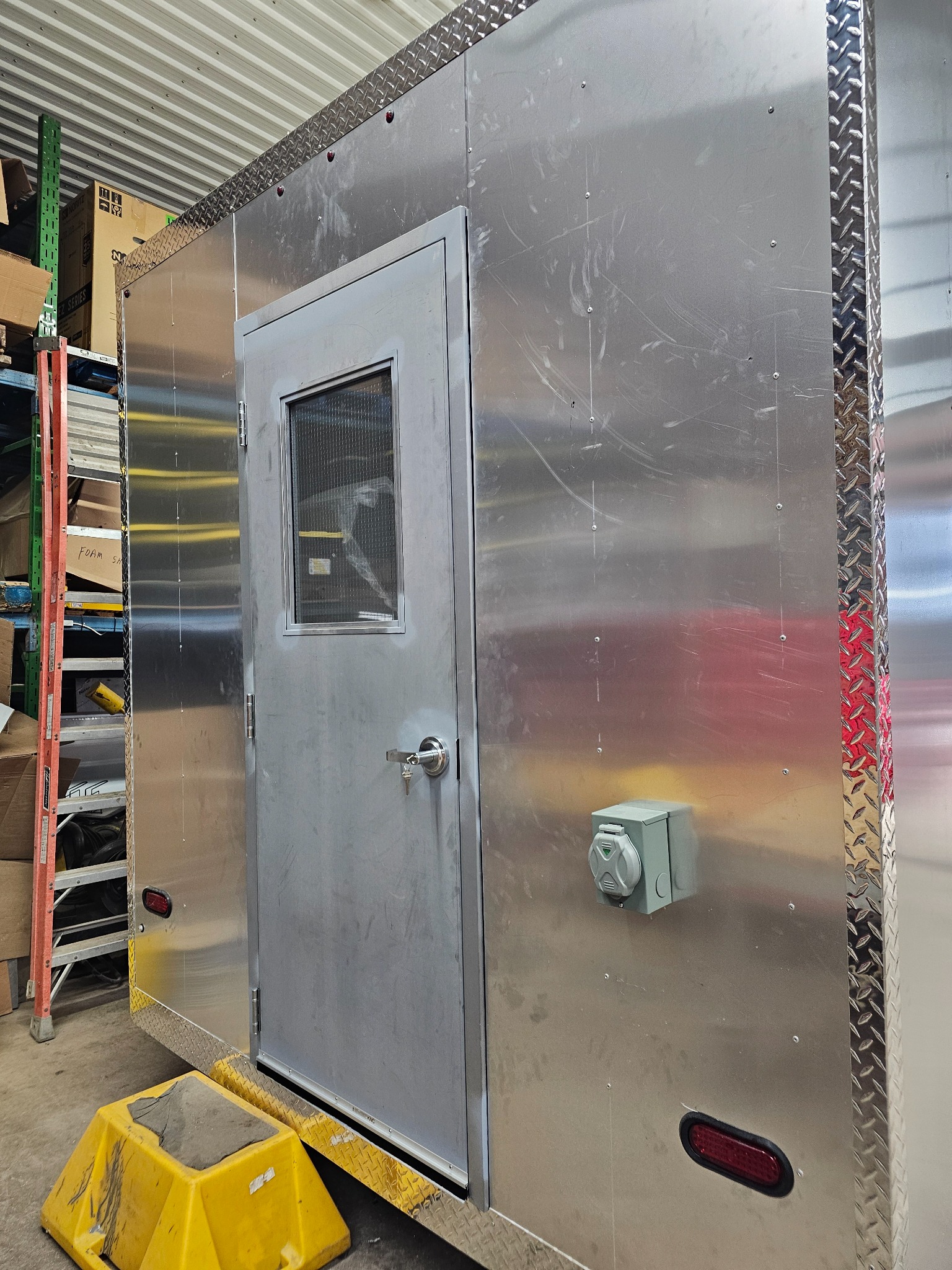 Exterior doorway and side of the trailer during construction
