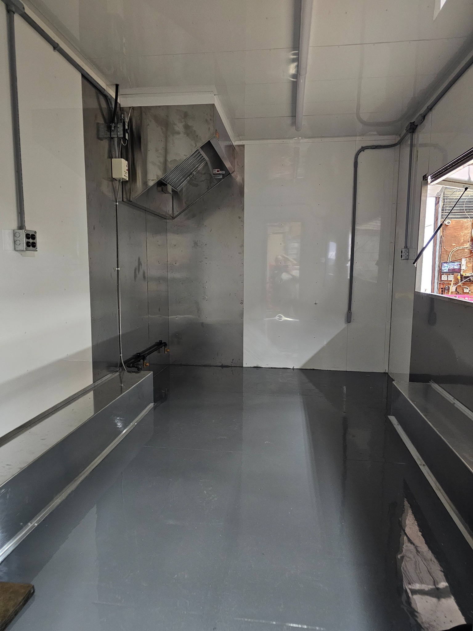 Long view inside the trailer showing the work areas