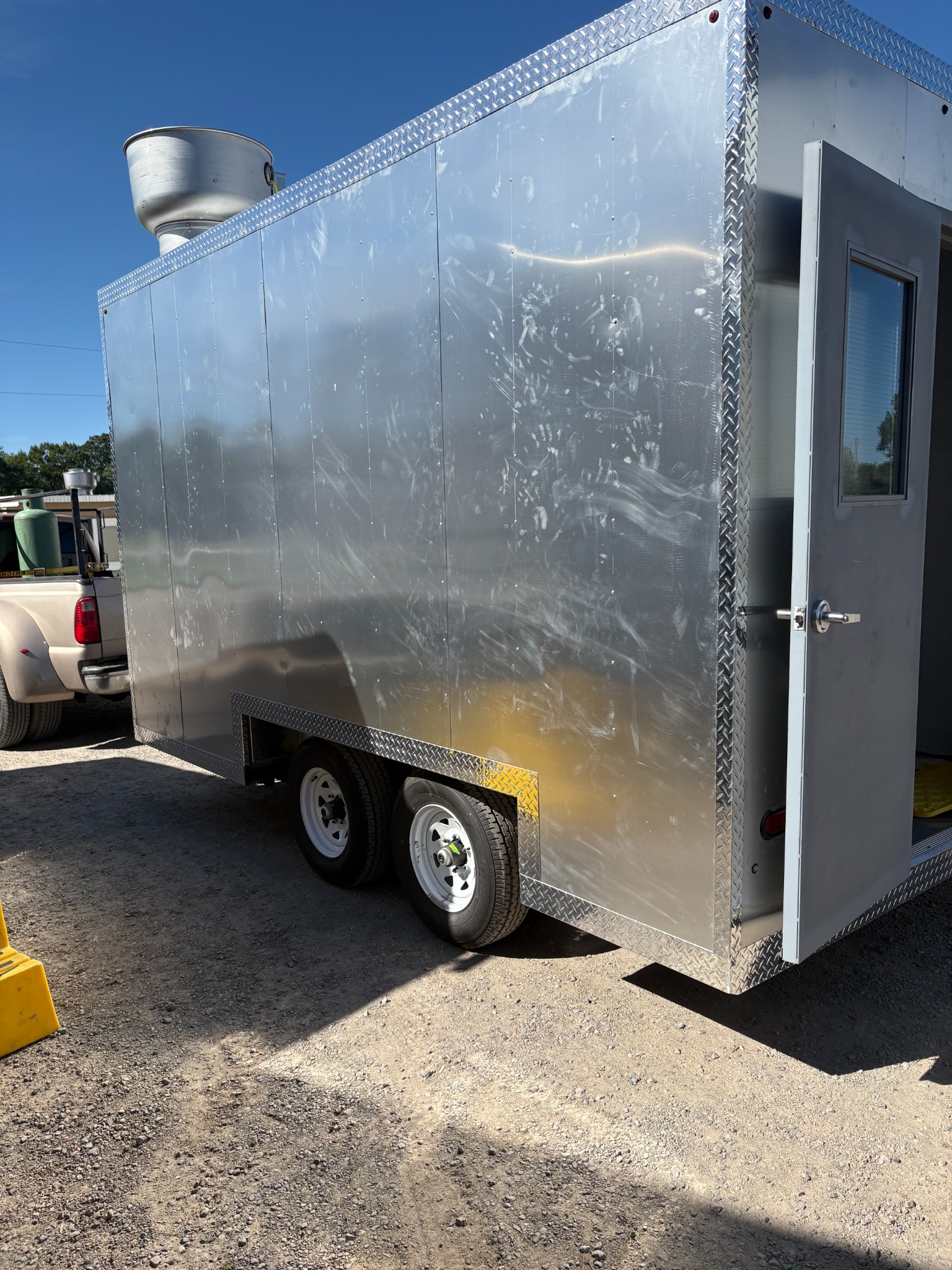Silver trailer exterior with its side entrance