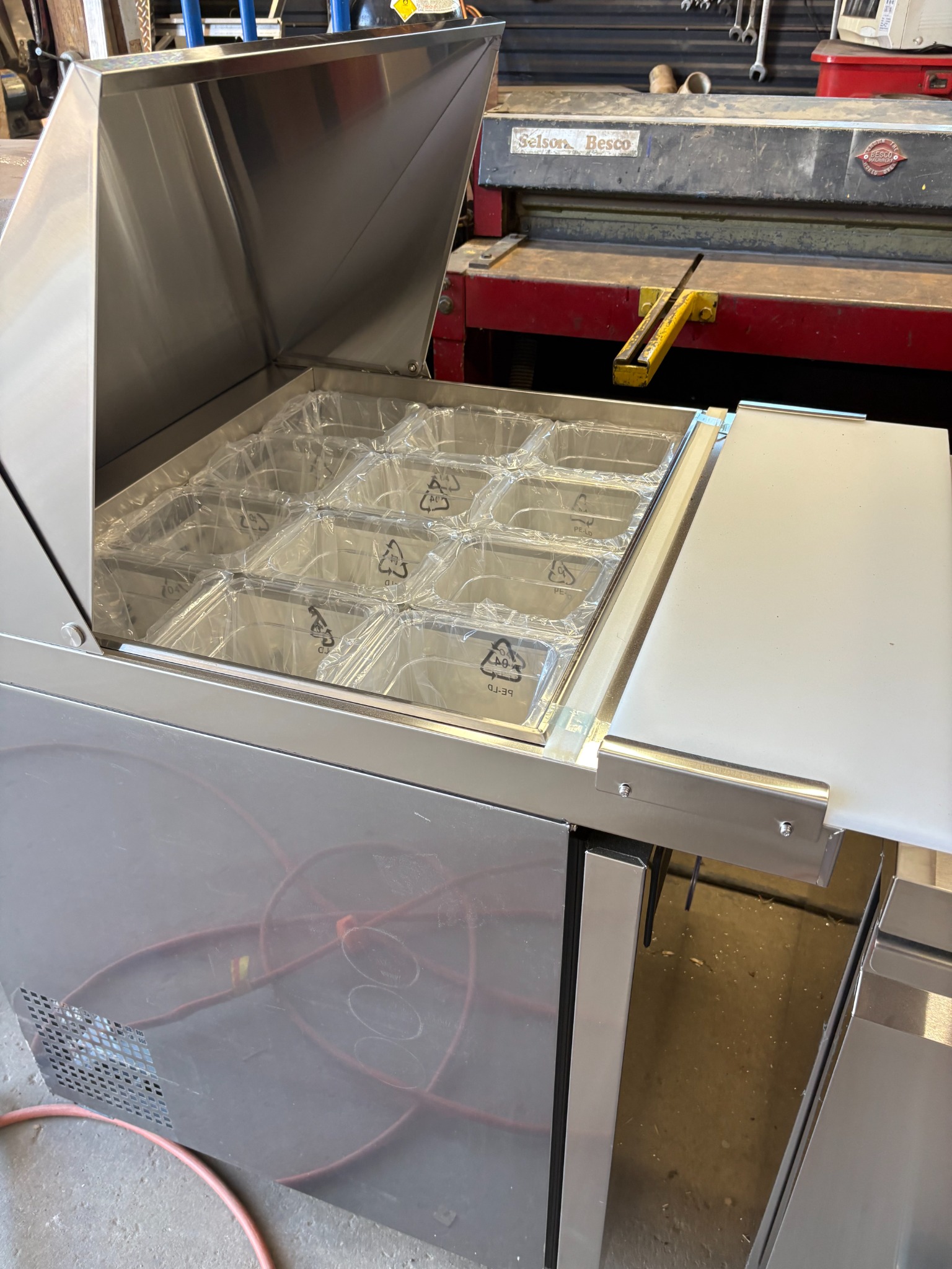 Refrigerated ingredient prep table, also called a cold table, in the workshop before installation