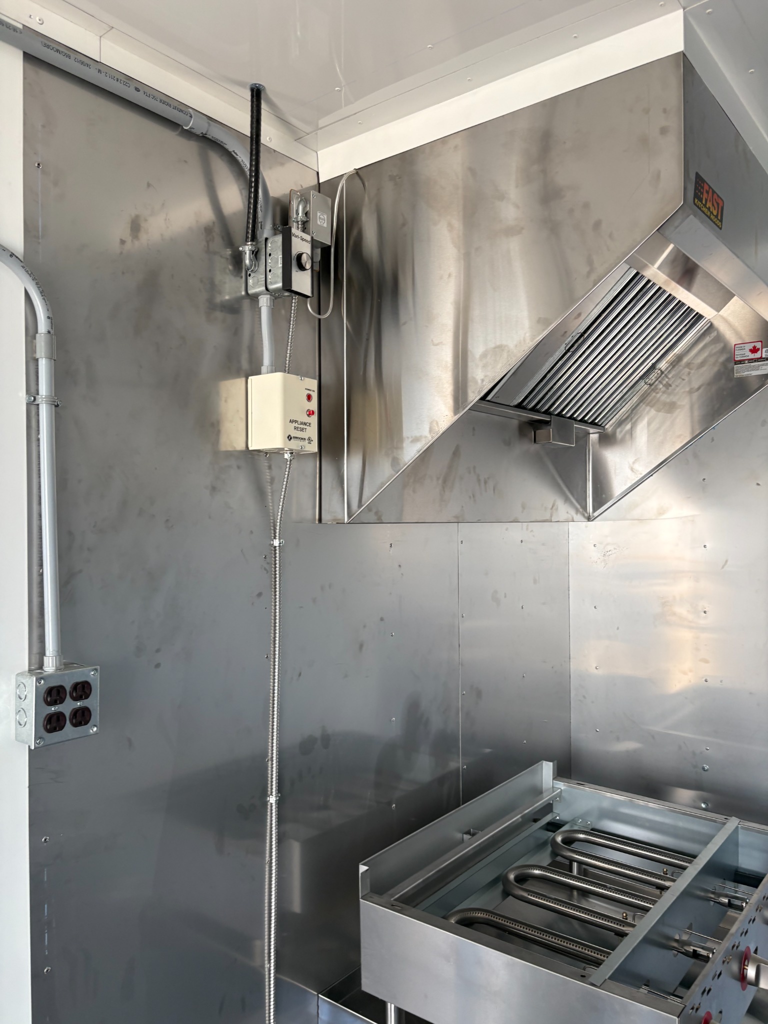 Stainless exhaust hood over the cooking area